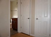 Thumbnail 17 of 22 - A white door is open to a room with a brown cabinet.