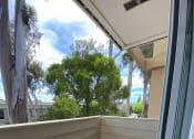 Thumbnail 5 of 10 - a balcony with a sliding glass door