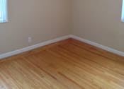 Thumbnail 16 of 22 - A room with wooden flooring and a window.