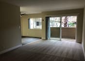 Thumbnail 24 of 43 - A room with a carpeted floor and a ceiling fan.