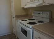 Thumbnail 9 of 31 - a kitchen with white appliances and white cabinets
