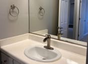 Thumbnail 51 of 51 - a bathroom with a sink and a mirror