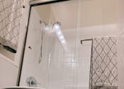 Thumbnail 6 of 16 - a bathroom with a toilet and a bathtub
