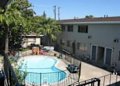 Thumbnail 28 of 32 - a large swimming pool in front of a house