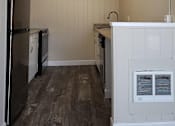 Thumbnail 3 of 44 - A kitchen with a refrigerator, oven, and sink.