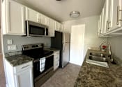 Thumbnail 2 of 17 - view of kitchen and appliances