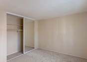 Thumbnail 20 of 23 - an empty living room with a closet in it