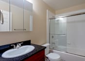 Thumbnail 21 of 23 - the preserve at ballantyne commons apartment bathroom with sink toilet and shower