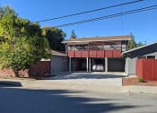 Thumbnail 6 of 36 - a house with a car parked in the driveway