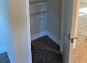 Thumbnail 3 of 43 - Empty white pantry with a white door.