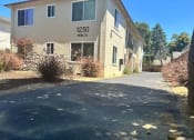 Thumbnail 19 of 19 - a building with a sidewalk in front of it