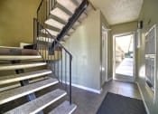 Thumbnail 12 of 51 - a staircase leading up to a house with a door
