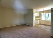 Thumbnail 15 of 20 - A room with a carpeted floor and a window.