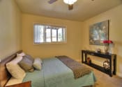 Thumbnail 16 of 35 - large bedroom with ceiling fan and window at The Arbors at Mountain View, California