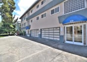 Thumbnail 5 of 31 - the entrance to a building with a blue and white garage door