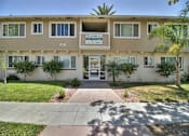 Thumbnail 1 of 37 - The image shows the front of a building with the number 520 and a sign that reads