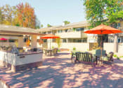 Thumbnail 93 of 103 - Umbrella Shaded Chairs By Pool at Balboa Apartments, Sunnyvale, California