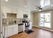 Thumbnail 50 of 80 - Modern Kitchen With Stainless Steel Appliances And Double Door Refrigerators at Casa Alberta Apartments, Sunnyvale, CA