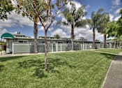 Thumbnail 3 of 24 - A green building with a sign that says Rental Office.