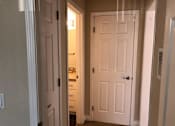 Thumbnail 59 of 62 - a hallway with a white door and a closet