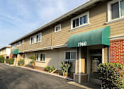 Thumbnail 29 of 62 - the front of a building with a green awning