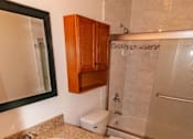 Thumbnail 16 of 25 - a bathroom with a sink toilet and a shower