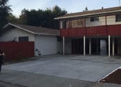 Thumbnail 10 of 36 - a house with a garage and a driveway