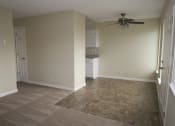 Thumbnail 14 of 31 - an empty living room with a ceiling fan