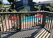 Thumbnail 17 of 17 - A pool is seen from a balcony.