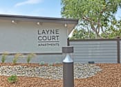 Thumbnail 25 of 44 - Layne Court sign on building