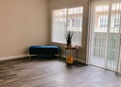 Thumbnail 7 of 16 - an empty room with a couch and a plant