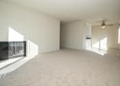 Thumbnail 26 of 41 - an empty living room with a fireplace