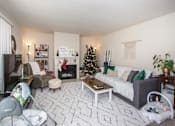 Thumbnail 29 of 41 - a living room with a christmas tree in the corner