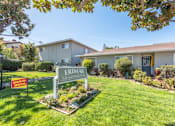 Thumbnail 8 of 32 - a house with a yard with a sign in front of it