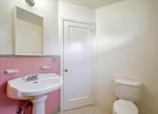 Thumbnail 15 of 25 - a bathroom with a sink toilet and a mirror