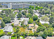 Thumbnail 4 of 25 - an aerial view of a city with buildings and trees
