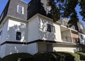 Thumbnail 3 of 15 - a white building with a tree in front of it