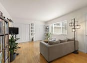 Thumbnail 1 of 43 - a living room with a couch and a tv