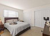 Thumbnail 2 of 43 - a bedroom with a bed and a closet