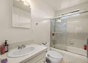 Thumbnail 4 of 43 - a bathroom with a sink toilet and a shower