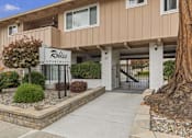 Thumbnail 6 of 43 - a sidewalk in front of a building with a ride apartments sign