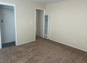 Thumbnail 3 of 13 - A room with a carpeted floor and a wall-mounted air conditioning unit.