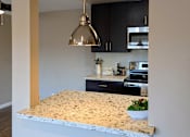 Thumbnail 5 of 11 - a view of a kitchen with a granite counter top