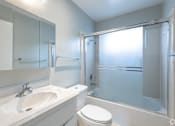 Thumbnail 27 of 30 - a bathroom with a sink toilet and a shower