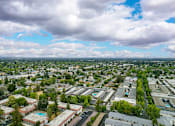 Thumbnail 4 of 30 - an aerial view of a city with many buildings and trees