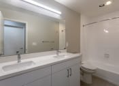 Thumbnail 17 of 20 - the preserve at ballantyne commons apartment bathroom with sink toilet and shower