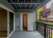 Thumbnail 20 of 20 - a front porch with a door and a balcony