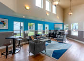 Thumbnail 5 of 20 - a living room with couches chairs and tables and a piano