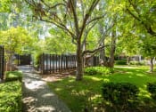 Thumbnail 2 of 16 - a yard with trees and a fence