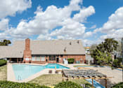 Thumbnail 5 of 8 - A house with a pool in the backyard.